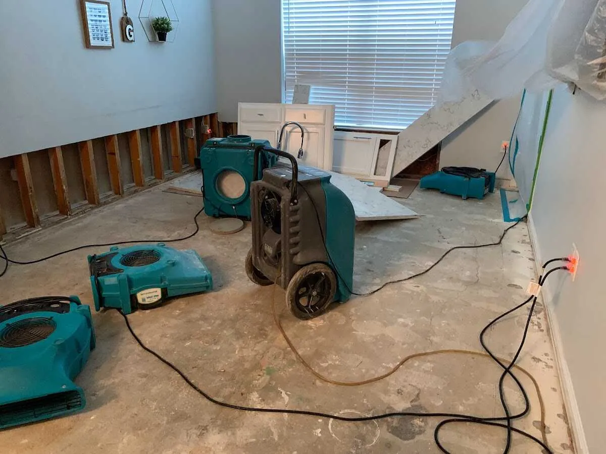 Dehumidifier in flood-cut room for Water Damage Restoration in East Manchester